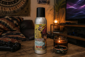 Front view of Wunderlust Smoke Odor Exterminator air freshener sitting on a table in a small bohemian living room