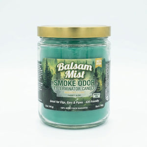 A Candle by Smoke Odor Exterminator, featuring crisp scent notes of fresh balsam, bergamot, forest greens, and aromatic pine.