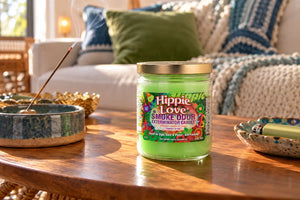 Hoppie Love Popular Smoke Odor Exterminator Candle on coffee table in cozy apartment