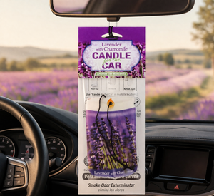 Car air freshener packaging with lavender and chamomile scent hanging from a car's rearview mirror.