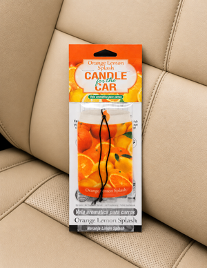 Orange Lemon Splash candle for car packaging on a beige car seat